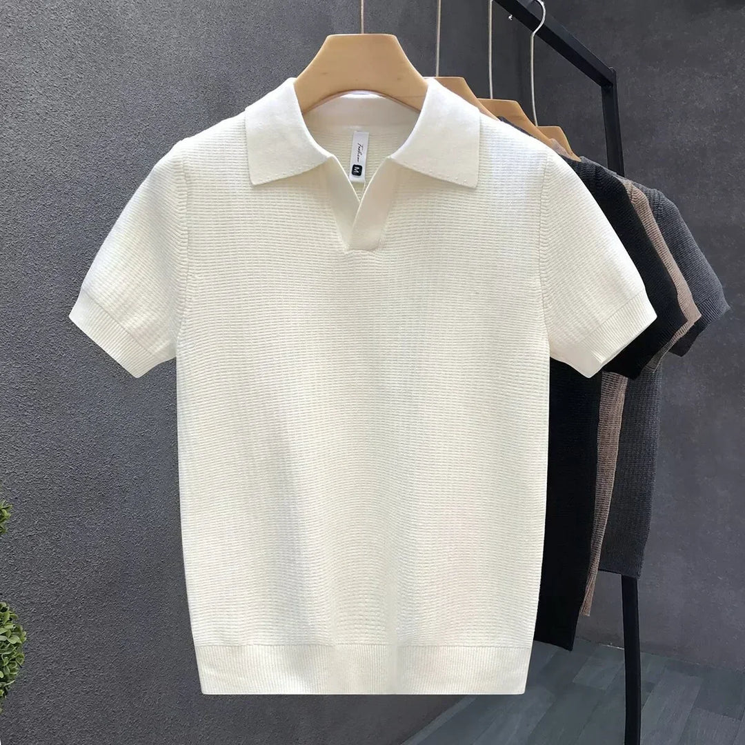 Comfortable men's knit polo with a stylish open collar. Soft, breathable short-sleeve design for casual outfits.