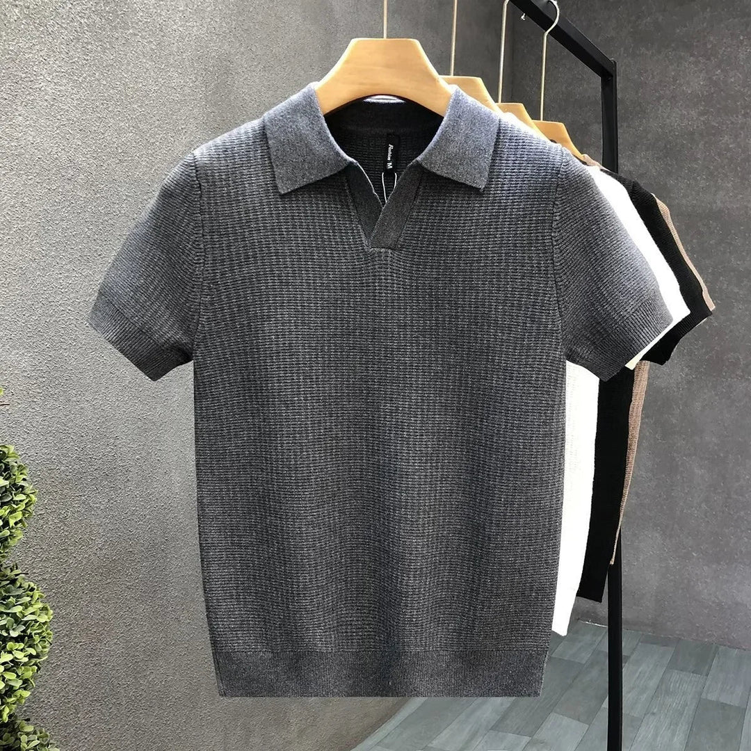 Stylish men's soft knit polo with an open collar & short sleeves, offering a breathable, relaxed fit for daily wear.