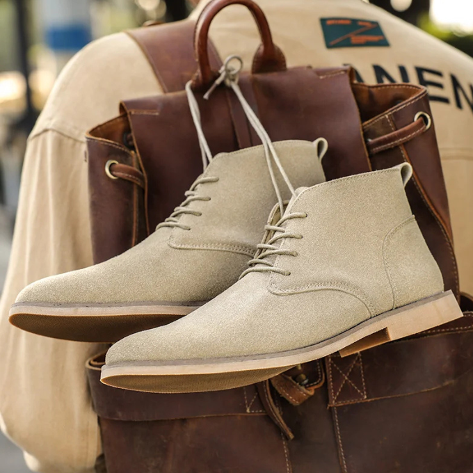 Stylish men's suede chukka boots in a neutral tone, suitable for any season.