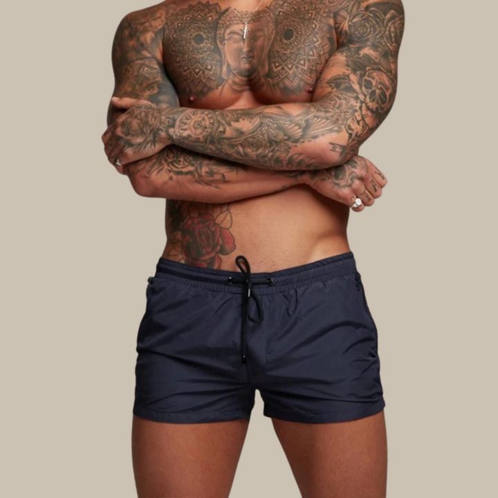 Flexible men's swim trunks, quick-dry and stretch fabric with an adjustable waist for a secure, comfortable fit.