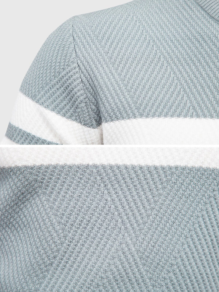 Close-up of the textured knit on a men's cotton blend striped crewneck sweater.