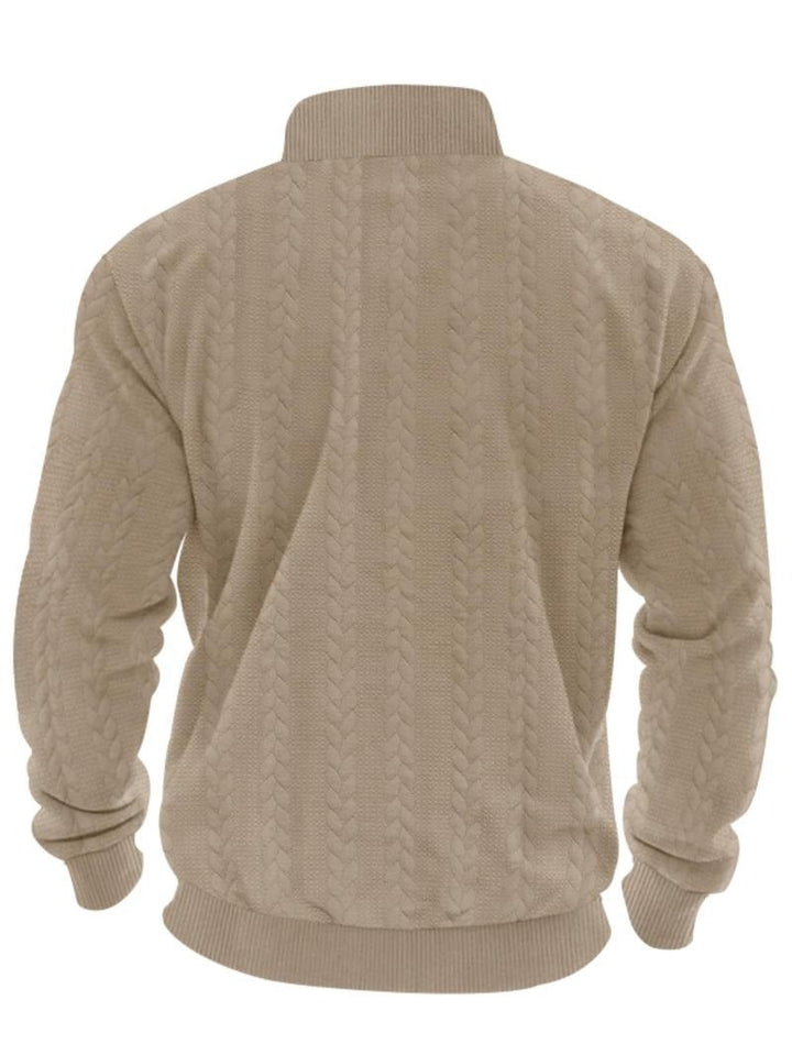 Detail of the half-zip closure on the men's knit sweater, a key feature of this stylish pullover