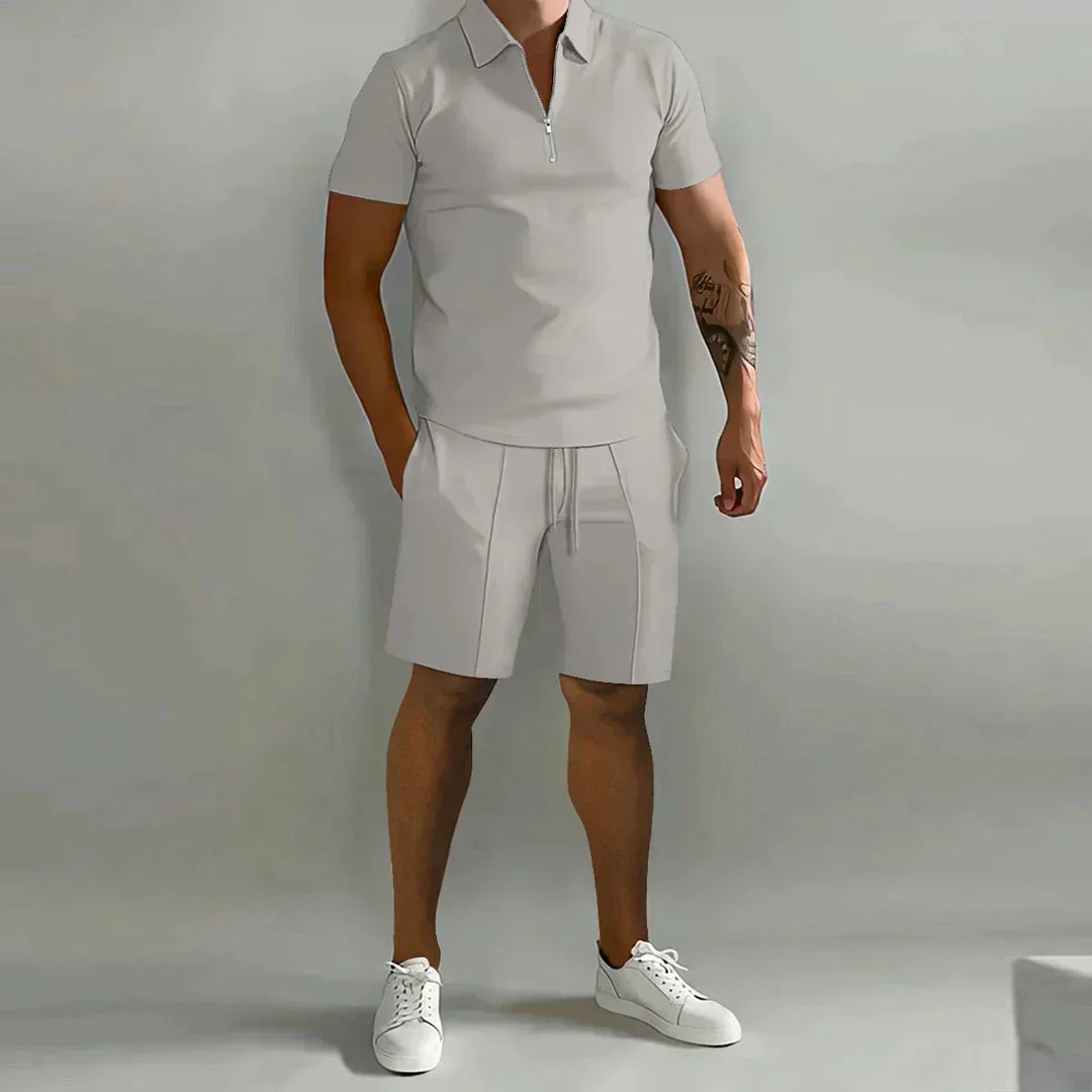 Men's vacation wear: stylish two-piece set featuring a zip polo and comfortable shorts.