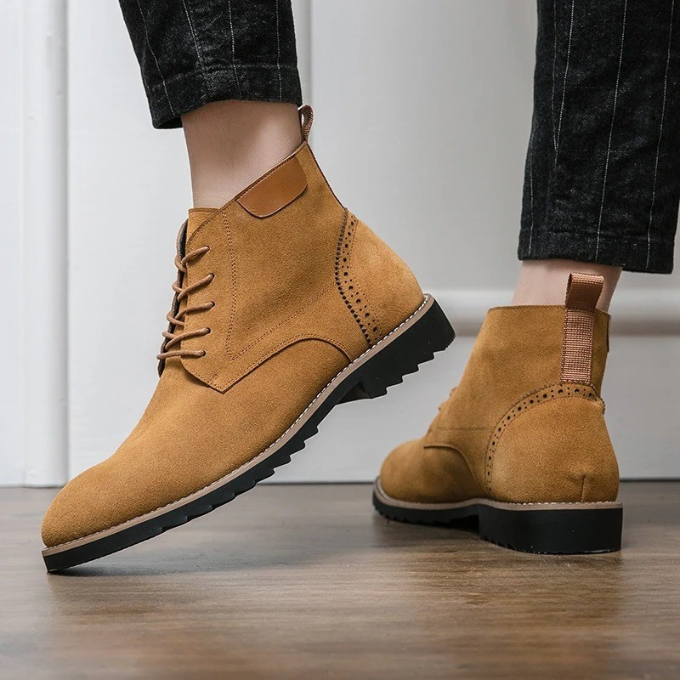Detailed close-up of men's genuine suede ankle boots, showcasing quality craftsmanship