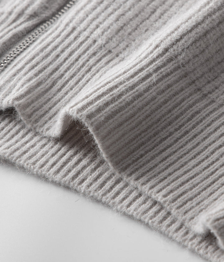 Man zipping up a stylish men's funnel neck sweater. Perfect versatile casual layering cardigan.