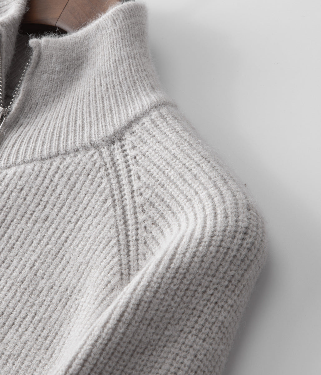 Men's stylish funnel neck zip-up sweater, ideal for smart casual layering with jeans.