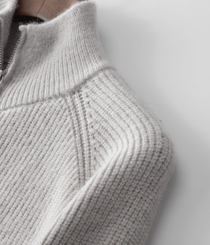 Men's stylish funnel neck zip-up sweater, ideal for smart casual layering with jeans.