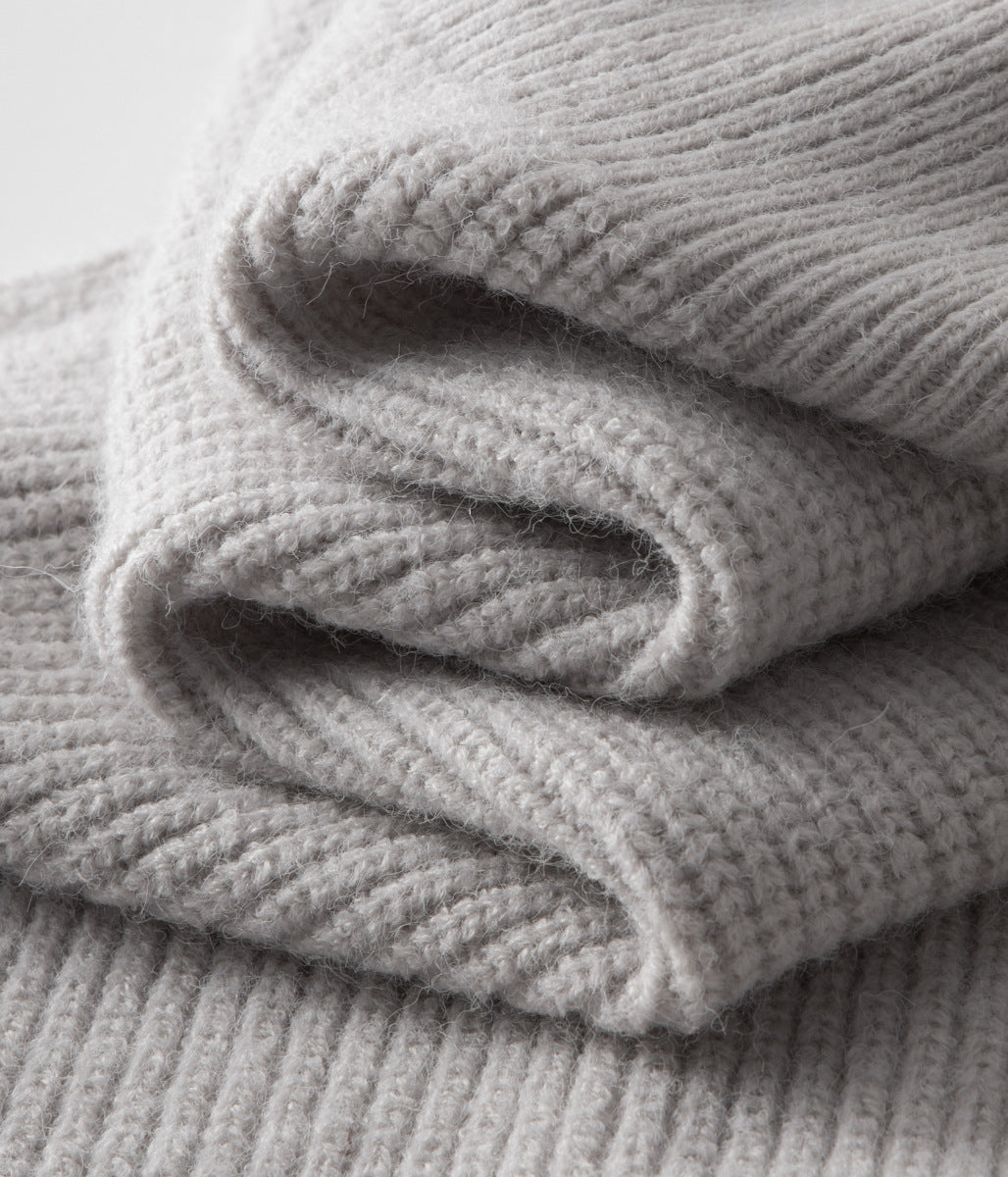 Man wearing a stylish funnel neck zip-up sweater. Perfect menswear for smart casual & casual layering.