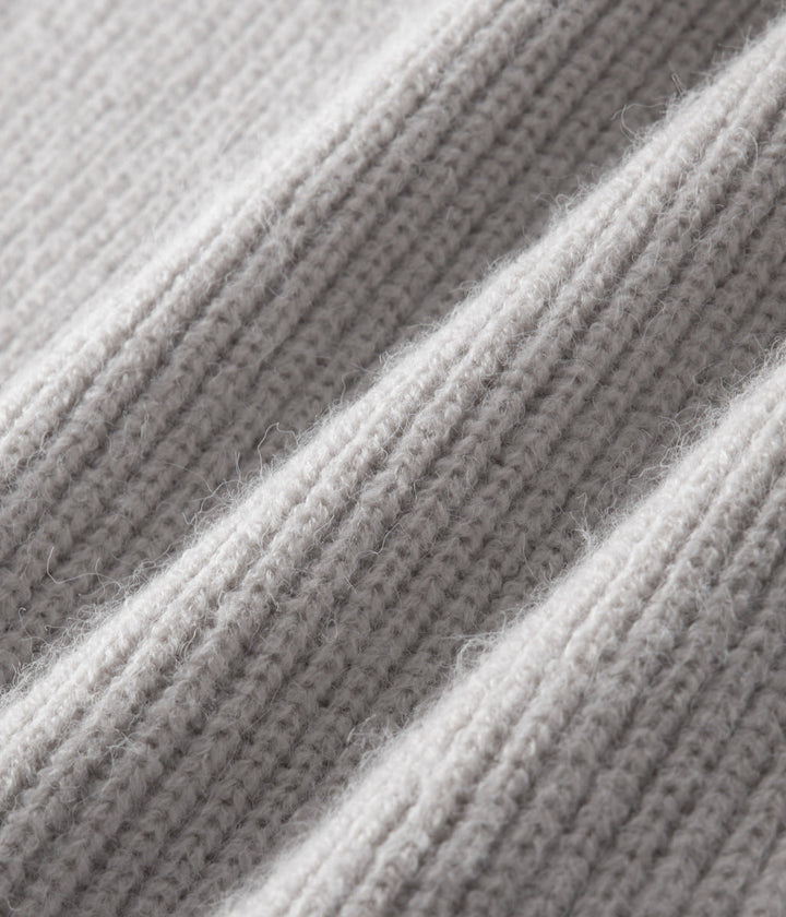 Folded men's stylish funnel neck zip-up sweater. Essential all-season casual layering menswear.