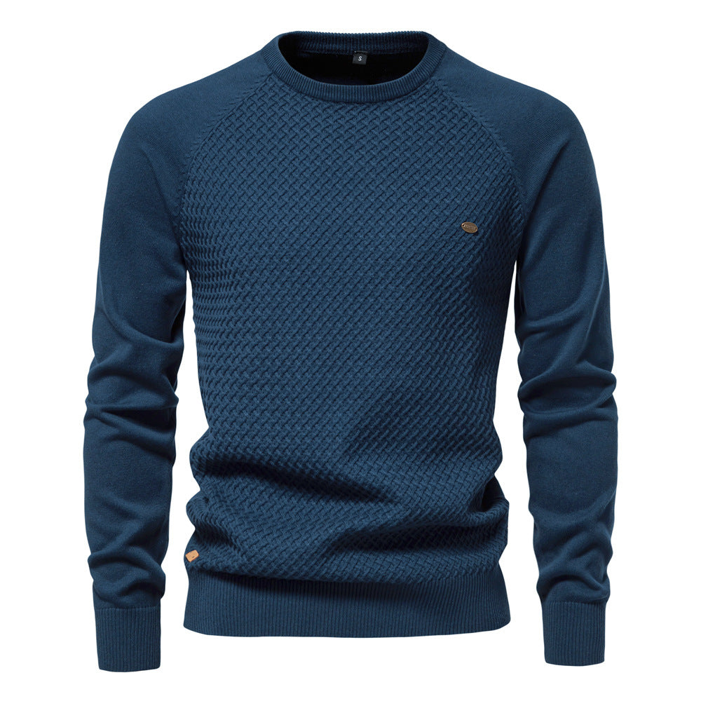 Close-up of men's waffle knit texture on a crewneck sweater, showcasing the cotton blend fabric detail