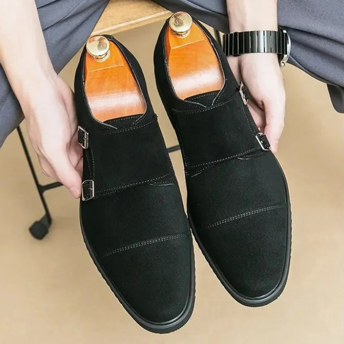 Front angle of men's dark brown suede double monk strap shoes with a clean design.