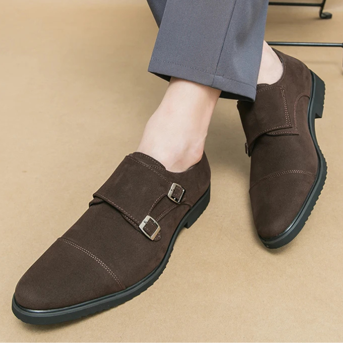 Pair of black suede double monk strap shoes for men, showcasing textured material.