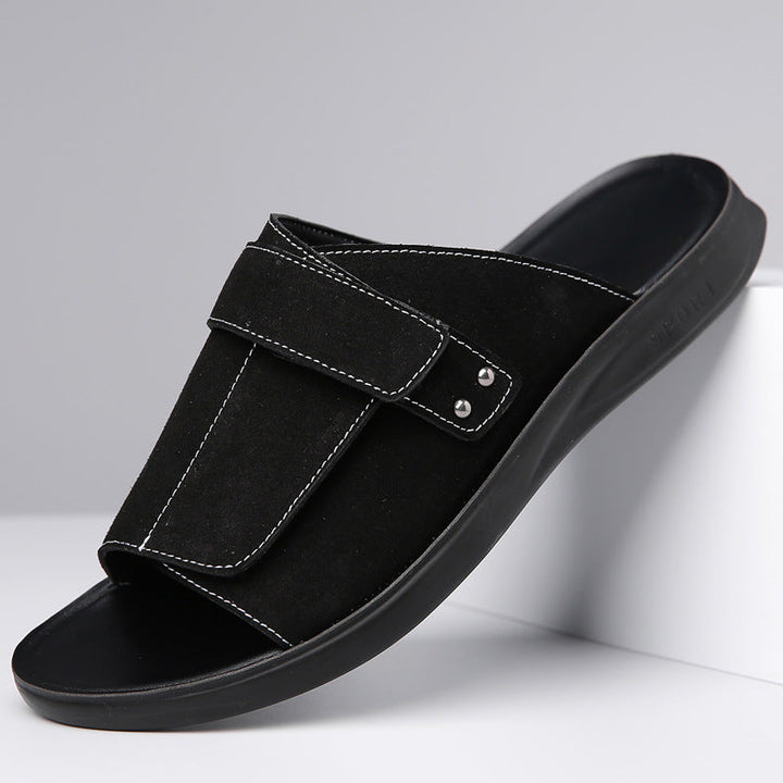 Stylish men's suede slides in a neutral color, ideal for comfortable daily wear.