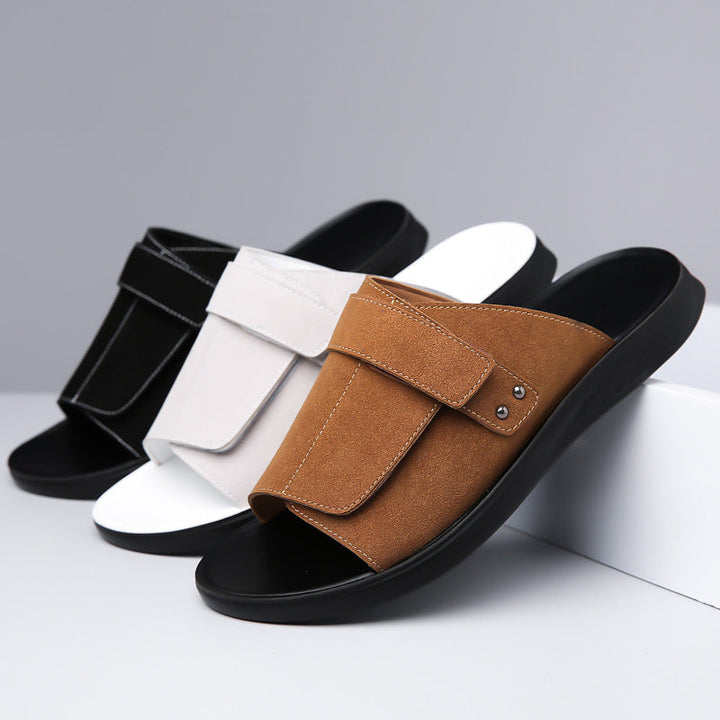 Detail of the adjustable strap on men's suede slide sandals for a custom fit.
