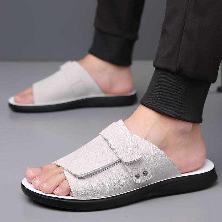 Overhead shot of men's suede slide sandals, highlighting their sleek and simple design.