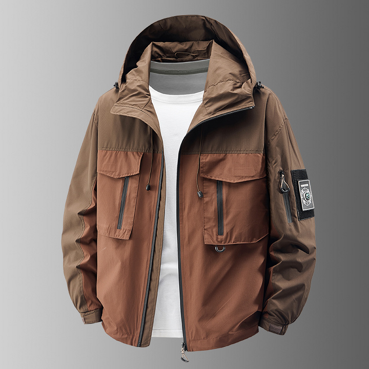 Men's outdoor adventure jacket, khaki, with multiple pockets, designed for rugged all-weather use.