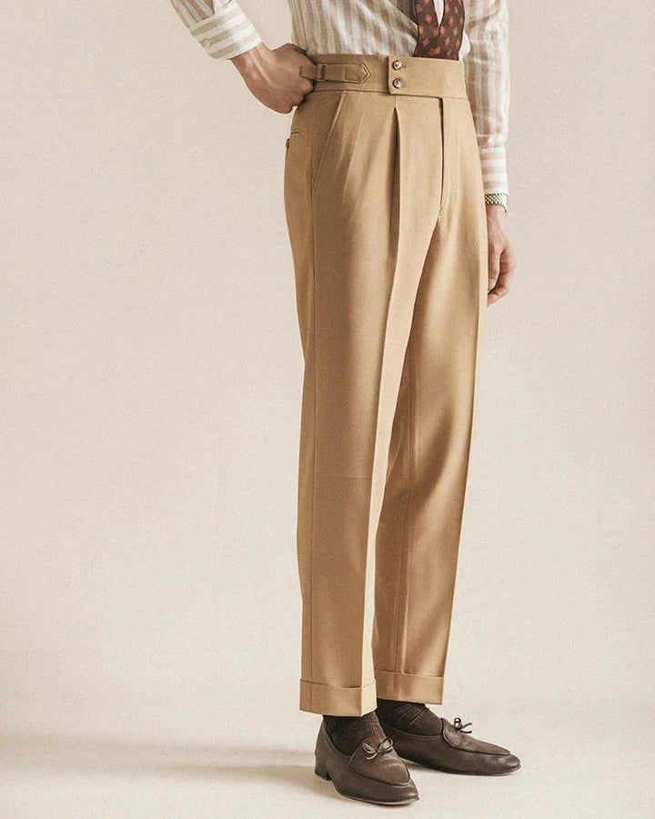 Three-quarter view of men's tailored navy business trousers, a staple for men's fashion.