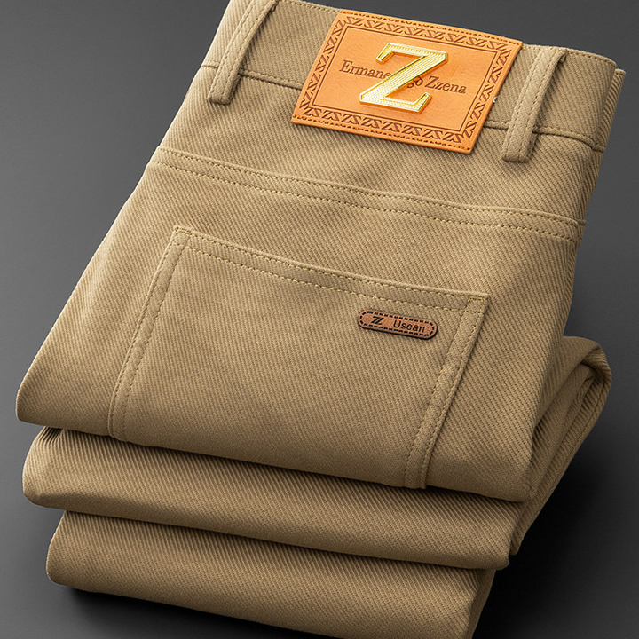 Close-up of the stretch denim fabric on men's tailored jeans, highlighting texture and quality.