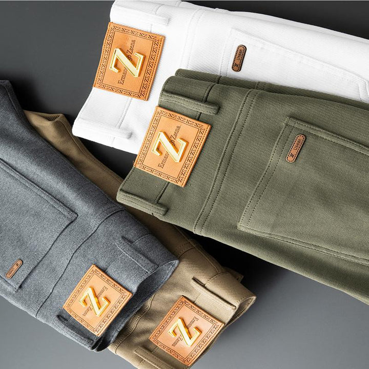 Side view of men's green tailored jeans, emphasizing the sleek cut and premium denim.