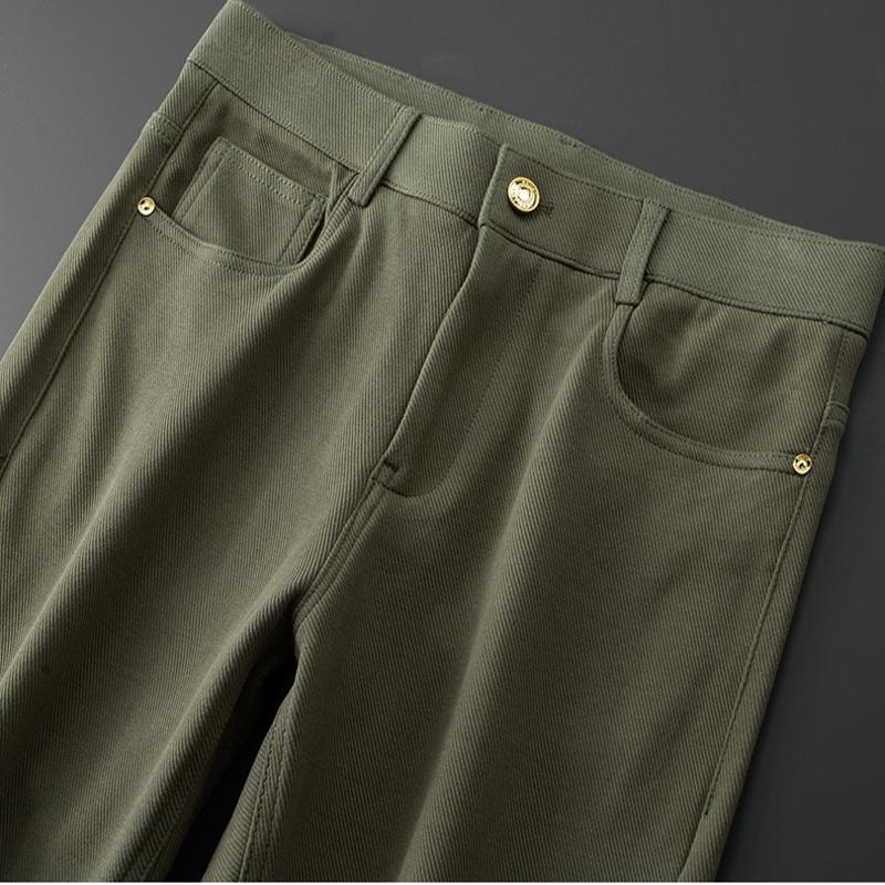 Back pocket detail on men's stretch denim jeans, subtle stitching and tailored design.