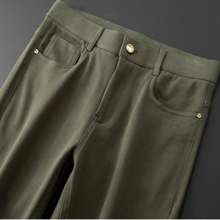 Back pocket detail on men's stretch denim jeans, subtle stitching and tailored design.