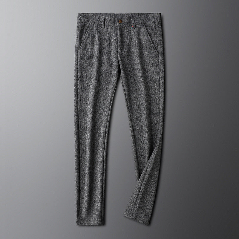 Man wearing tailored champagne dress trousers, styled for smart casual attire.