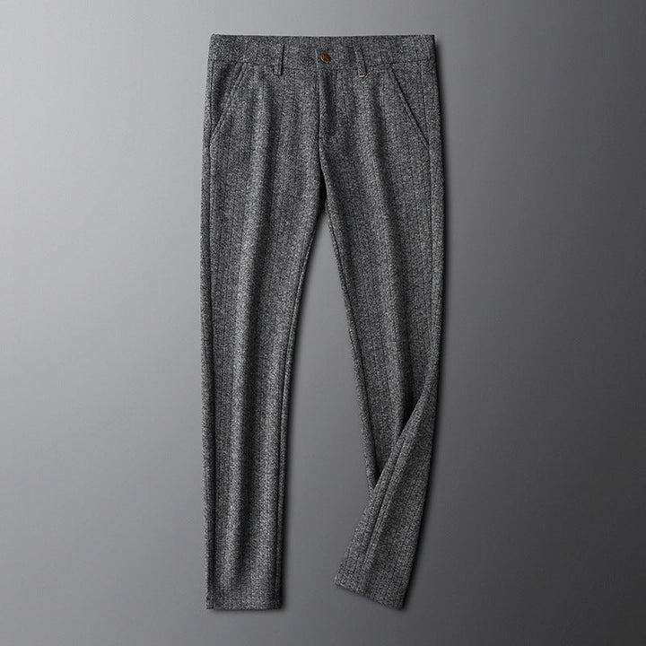 Man wearing tailored champagne dress trousers, styled for smart casual attire.
