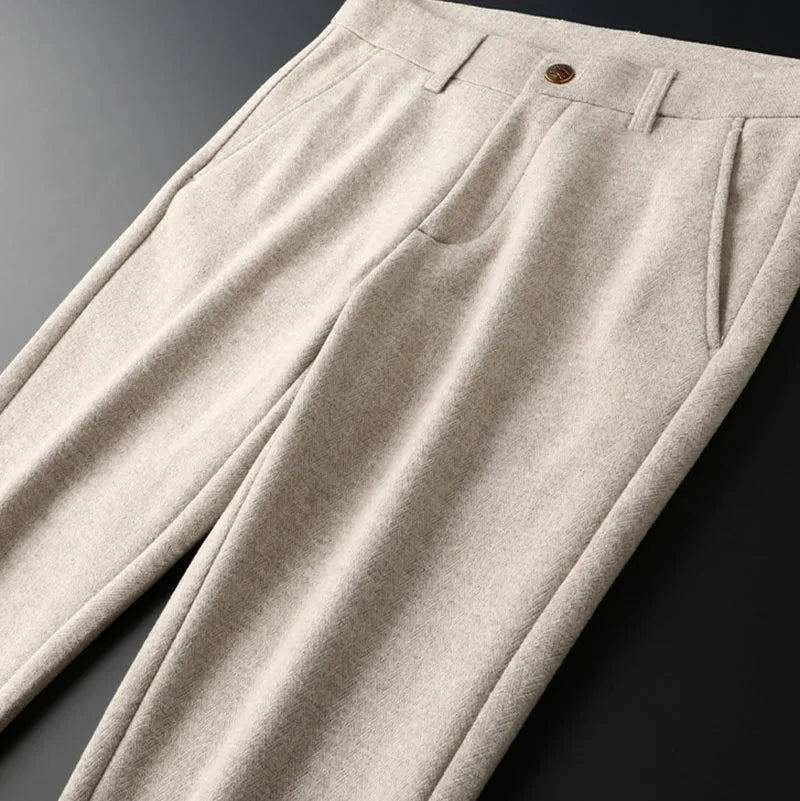 Men's dark grey tailored pants, providing a sleek and professional appearance.