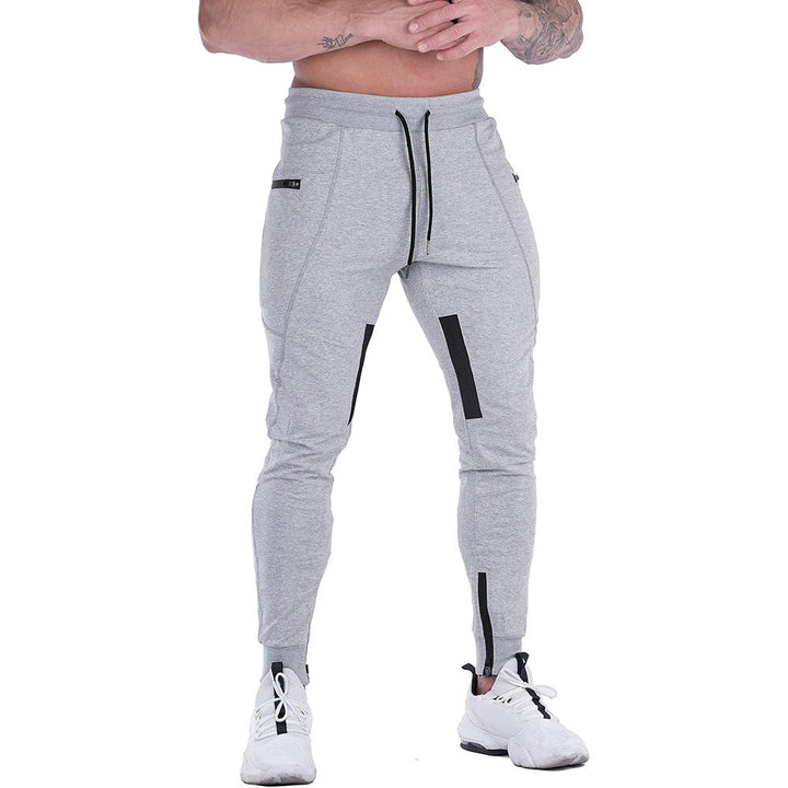 Collection of men's tapered athletic joggers in various colors: black, gray, navy
