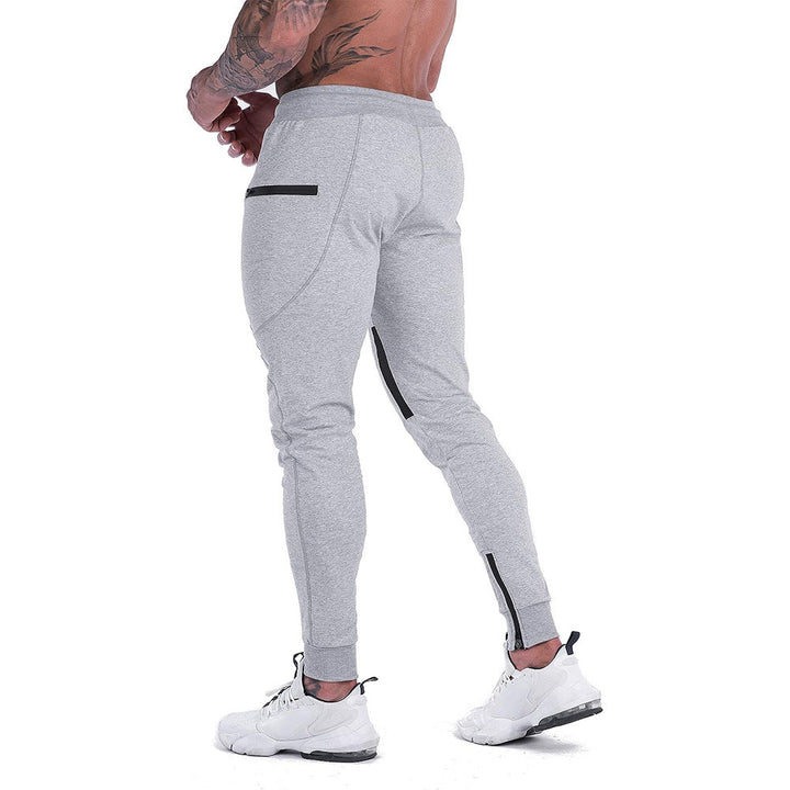 Man relaxing on a couch, wearing comfortable men's tapered cotton blend joggers
