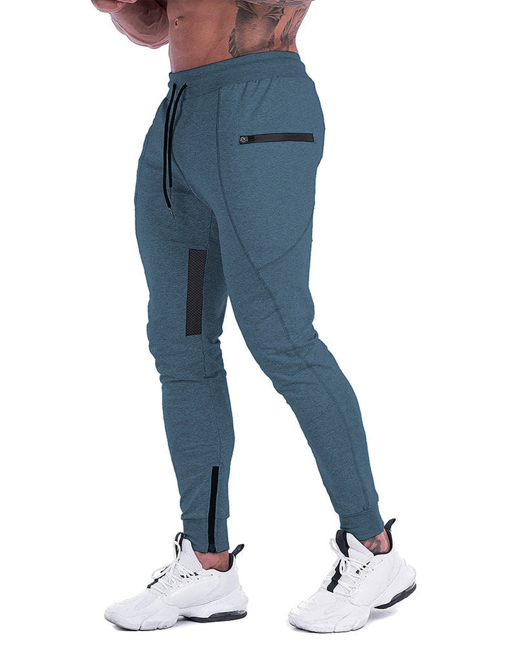Man stretching in men's tapered athletic joggers, highlighting activewear features