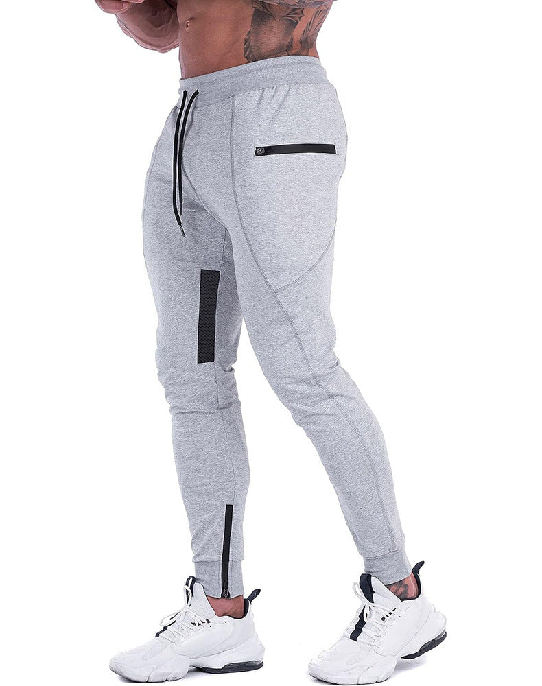 Man walking briskly in men's tapered athletic joggers, performance activewear