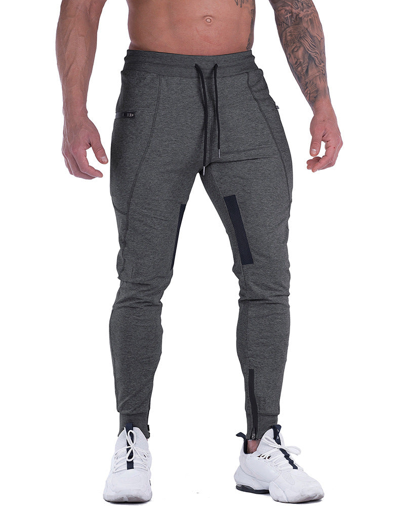 Full shot of a man wearing black tapered athletic joggers, ideal for casual wear