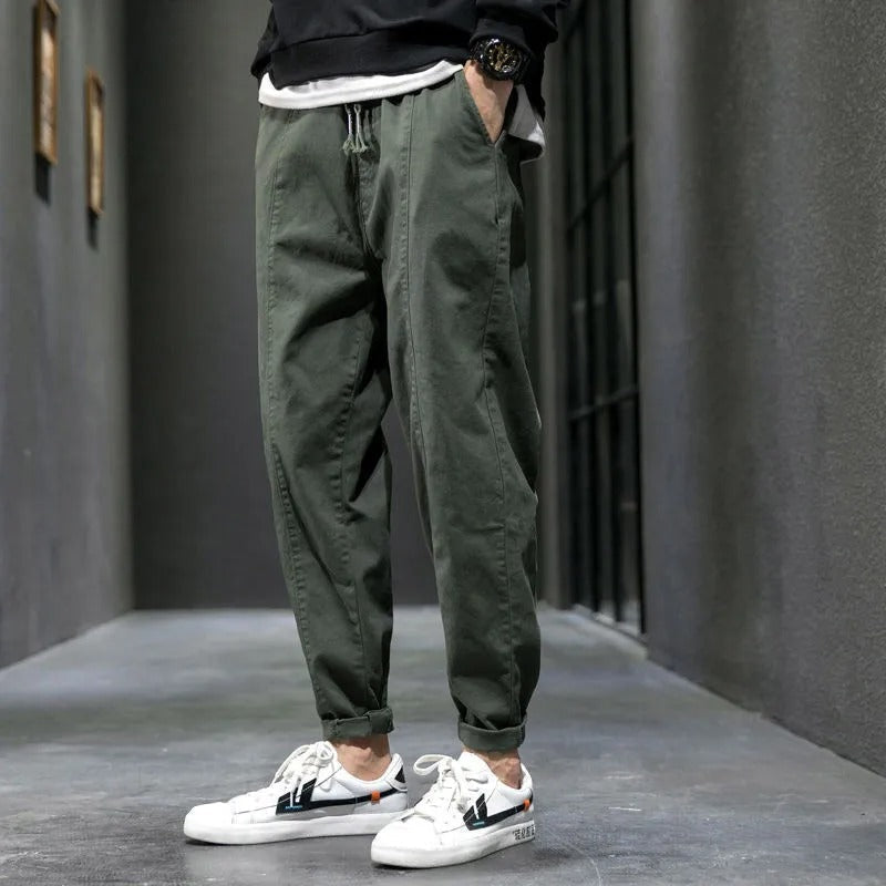 Close-up of the cotton blend fabric on men's tapered joggers, perfect for everyday athletic wear.