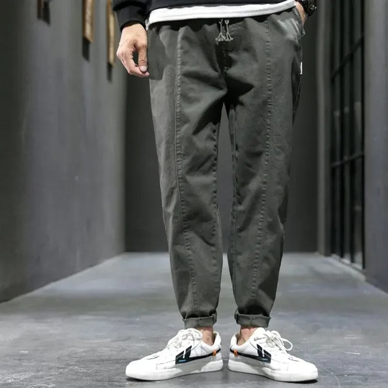 Close-up of the ankle cuff on men's tapered joggers, a key feature for athletic pants.