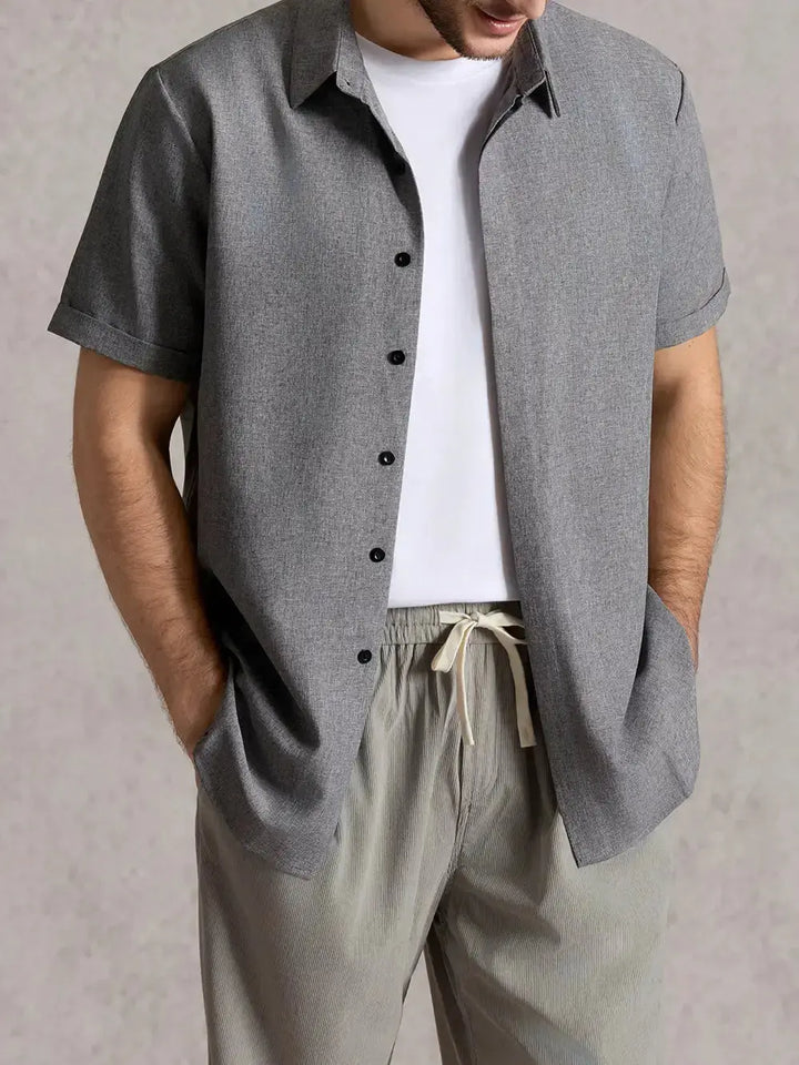 Textured short sleeve men's shirt, button down, collared, for stylish everyday wear.