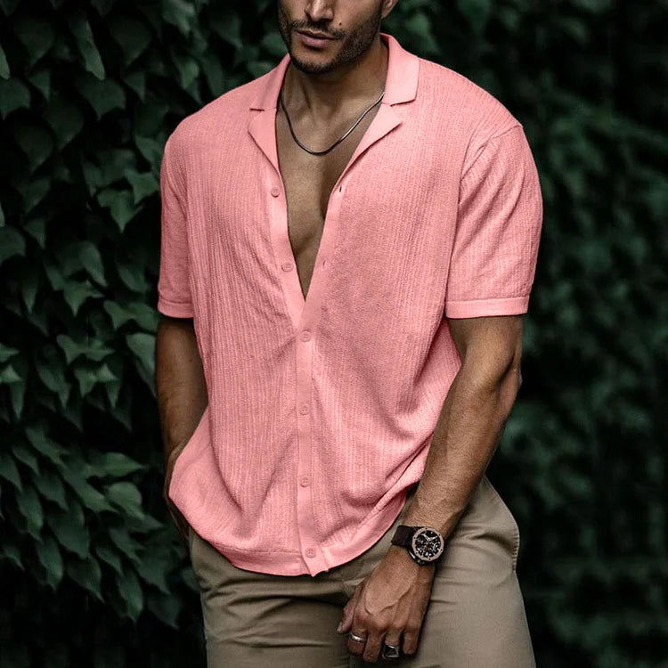 Detail shot: Stylish Cuban collar on a men's textured short sleeve summer shirt. Button-down, relaxed fit.