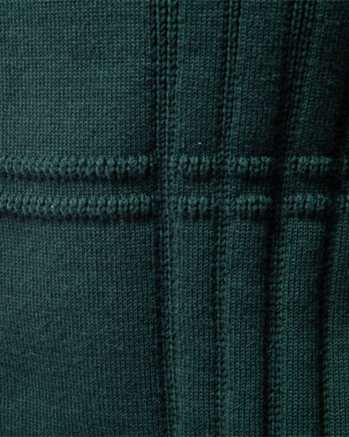 Model smiling while wearing a comfortable men's textured knit crew neck sweater