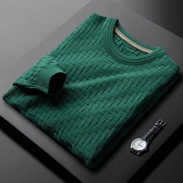 Close-up of a men's textured knit crew neck sweater, showcasing the intricate weave and soft cotton blend.