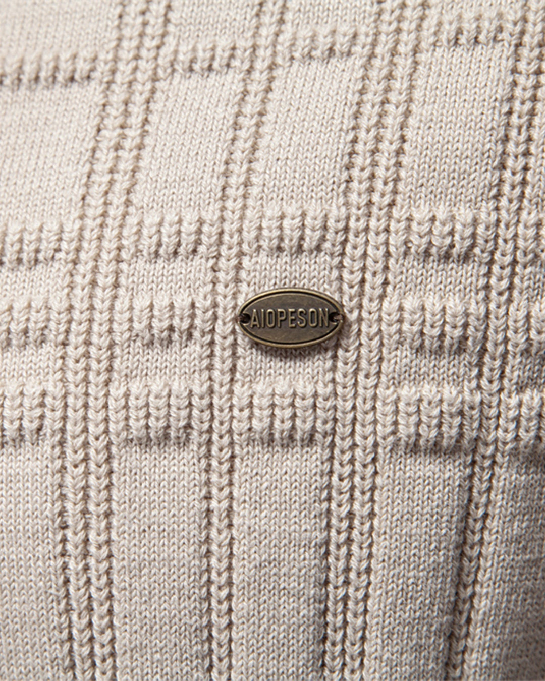 Studio image of a men's textured crew neck sweater showcasing its true color