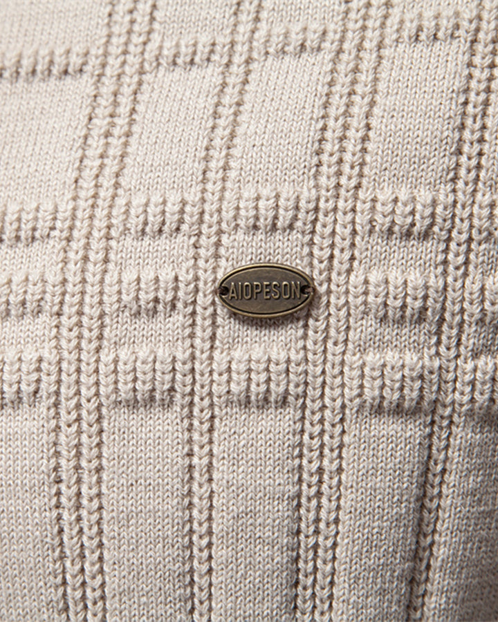 Studio image of a men's textured crew neck sweater showcasing its true color