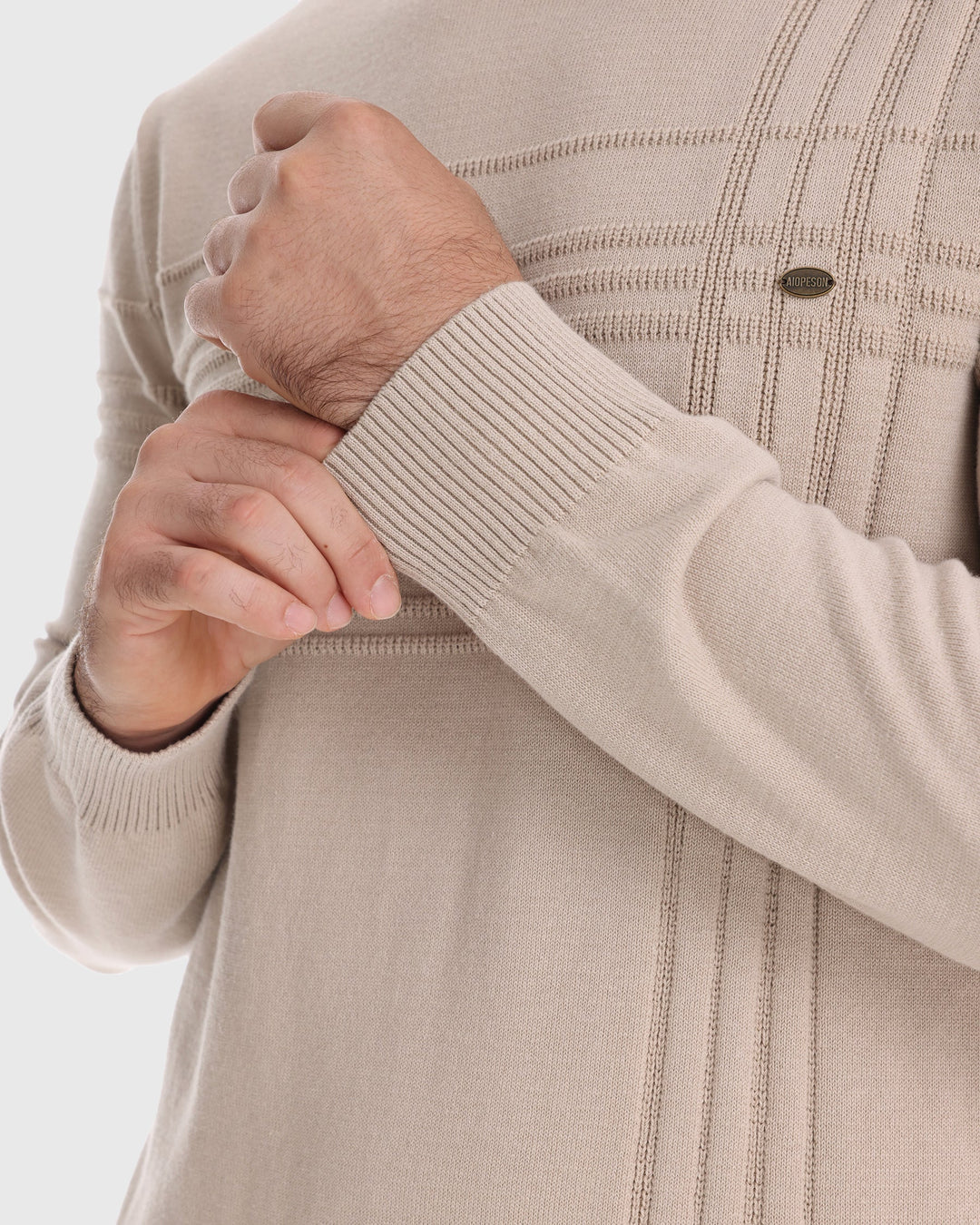 Men's winter wear: a textured crew neck sweater layered for warmth and style