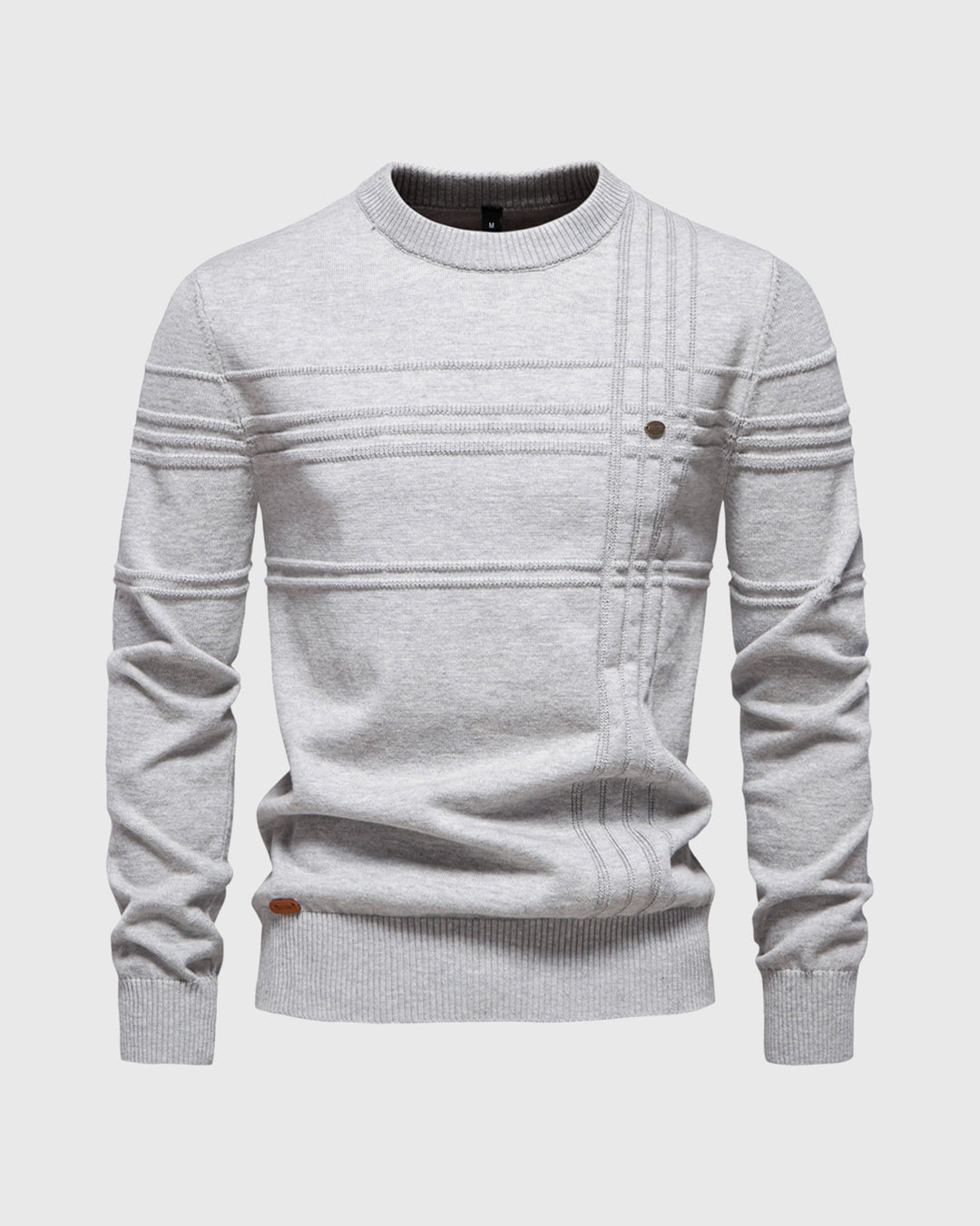 Studio shot of a folded men's premium knit long sleeve crew neck sweater