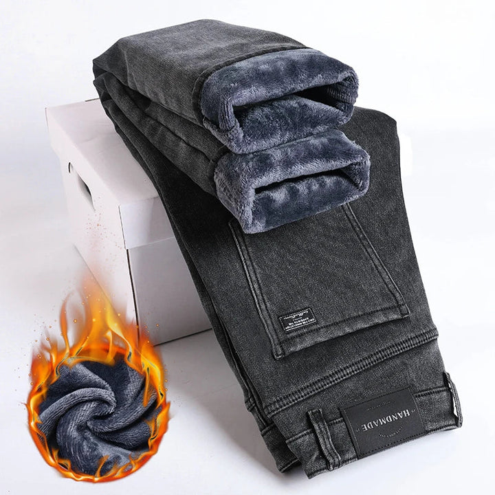 Close-up of men's thermal denim jeans fabric, showing fleece lining detail. Ideal for cold weather.