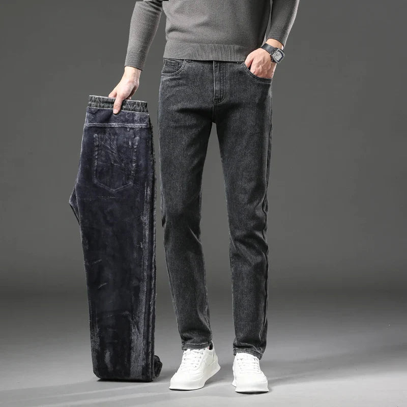 Full length side view of men wearing slim fit, fleece lined denim jeans. Great for winter apparel.