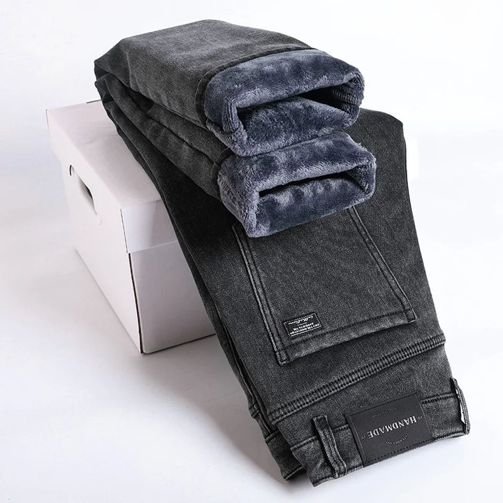 Stacked pair of men's thermal lined slim fit denim jeans, showcasing the soft inner fleece. Winter ready.