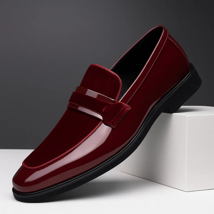Side view of men's dark brown leather penny loafers, emphasizing texture and easy slip-on comfort.