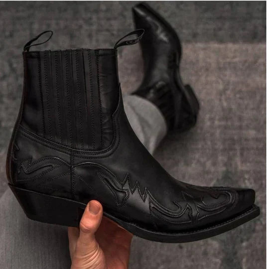 Men's traditional brown leather cowboy boots with classic western stitching, pointed toe, and stacked heel.