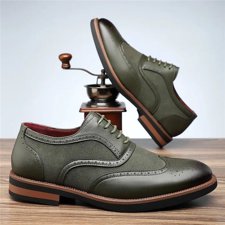 Close-up of the brogue detailing on men's two-tone wingtip oxford dress shoes