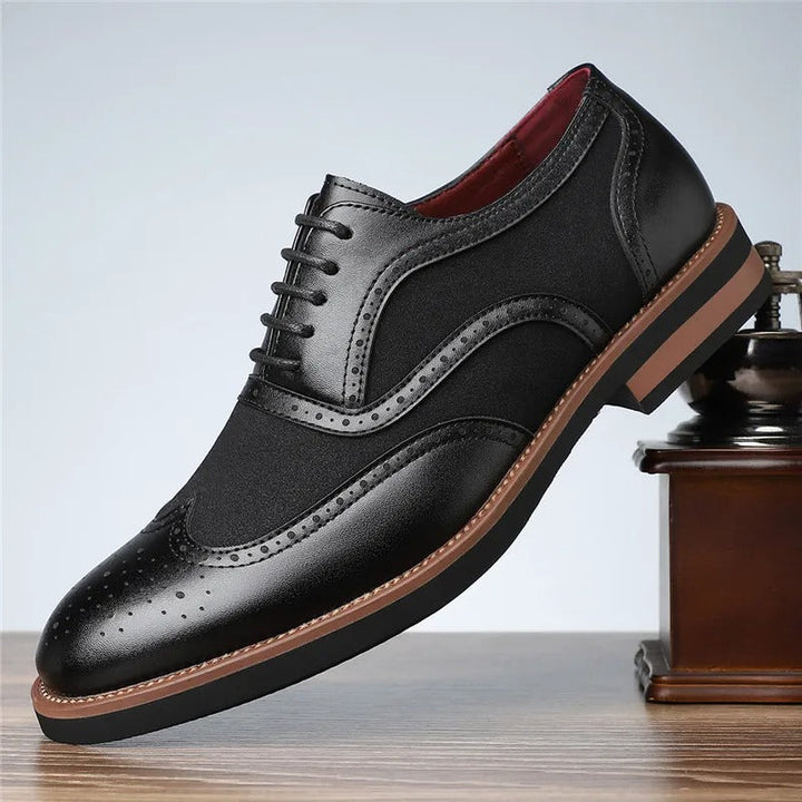 Pair of men's two-tone wingtip brogue oxfords, suitable for formal or casual wear
